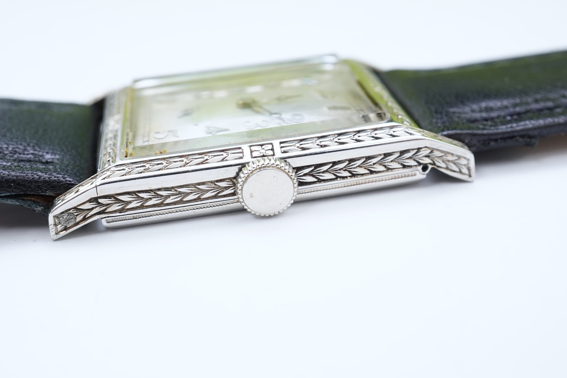 A lady's 18k white gold International Watch Company manual wind wrist watch, on a later associated leather strap
